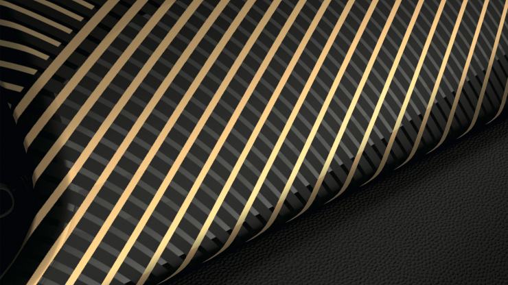 Nahaufnahme einer dunklen Innenraumleiste mit goldfarbenem Linienmuster Nahaufnahme einer dunklen Innenraumleiste mit goldfarbenem Linienmuster.